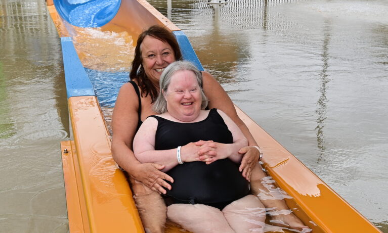 Two women on the water slide