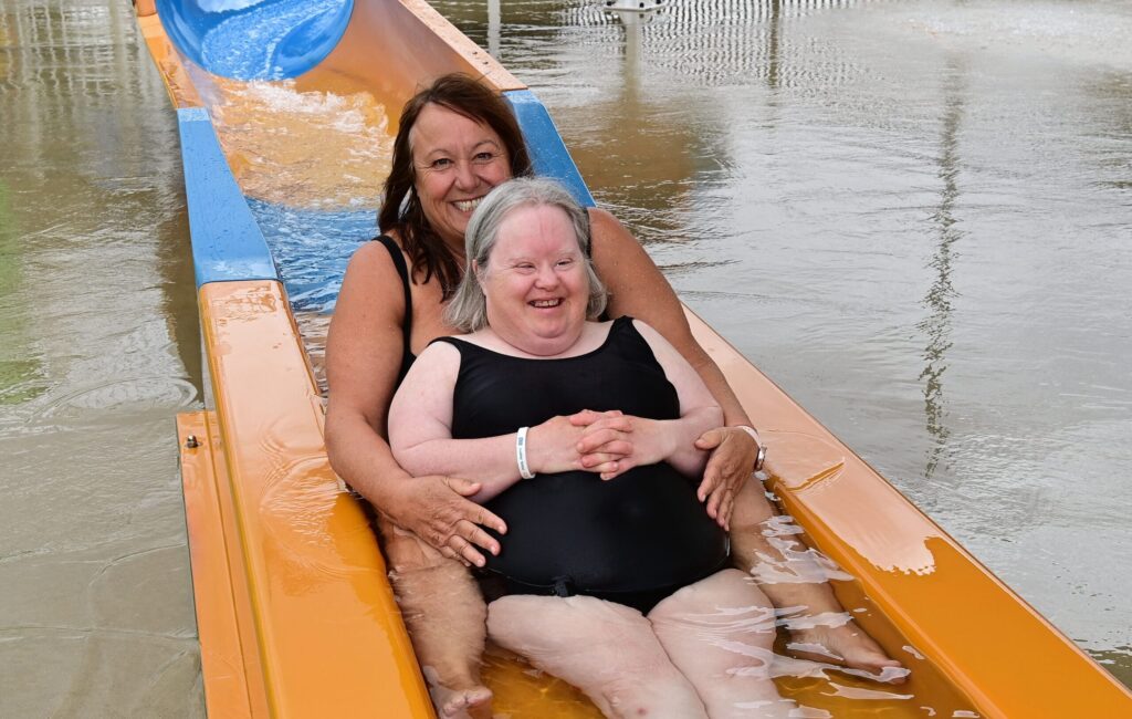 Two women on the water slide
