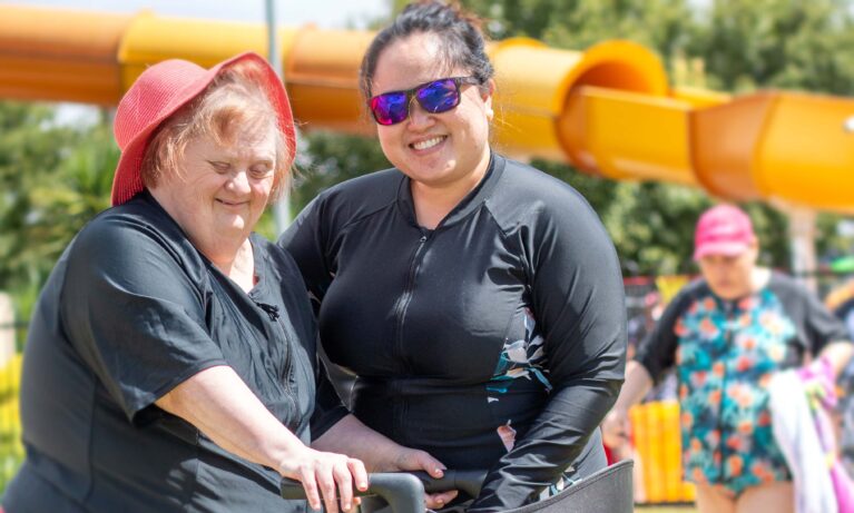 Client and support worker enjoying the pool activites