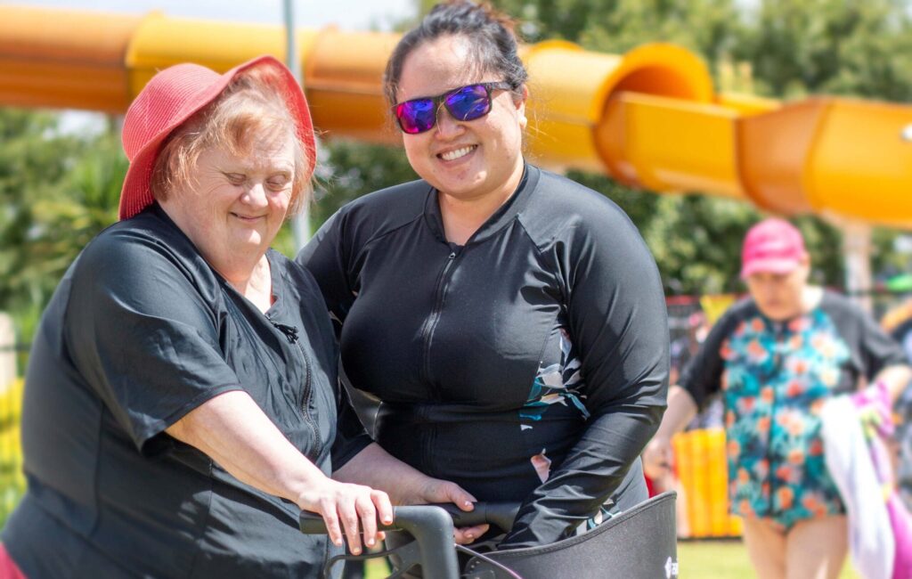 Client and support worker enjoying the pool activites